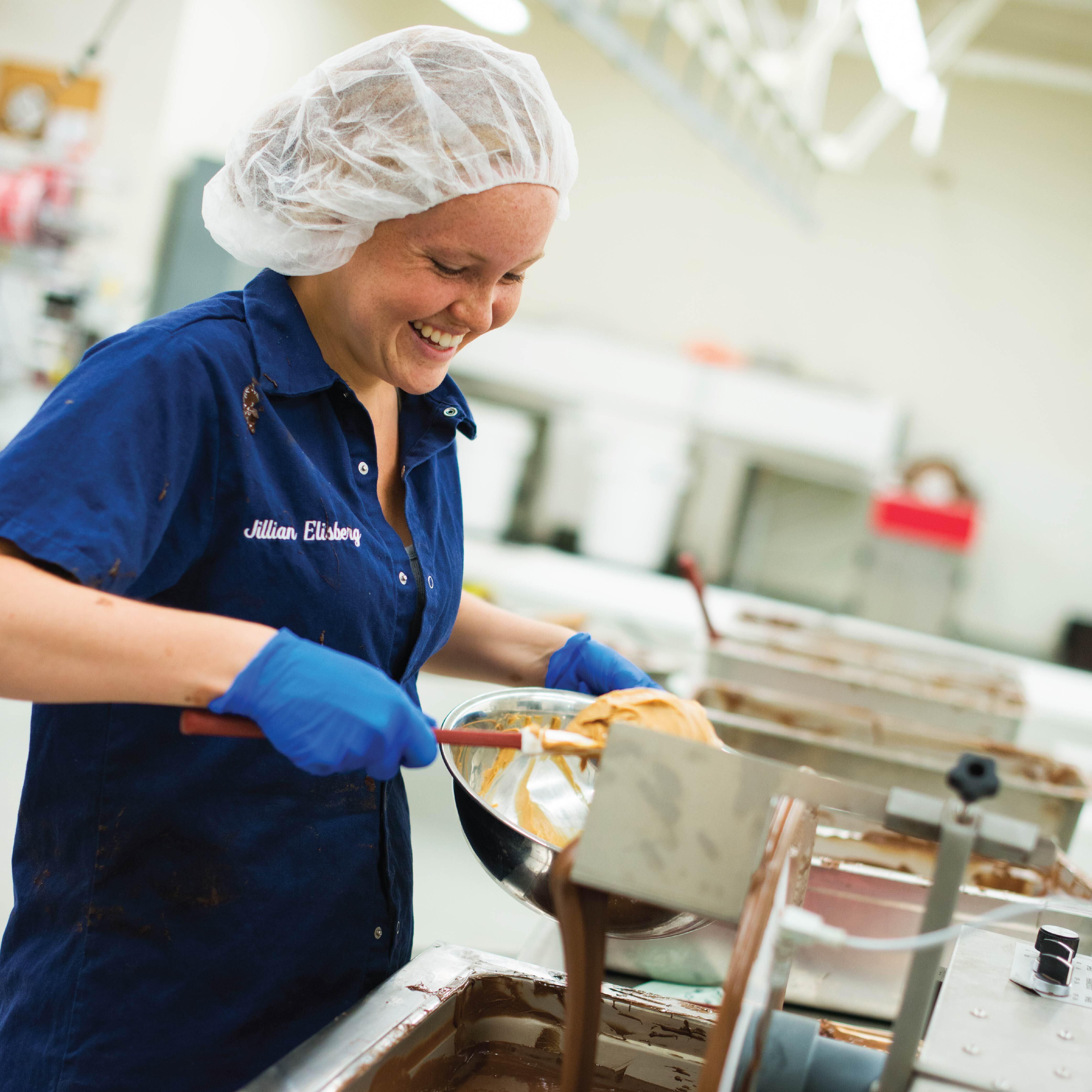 Cal Poly student employee pouring chocolate