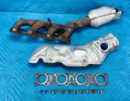 2011-2019 Infiniti QX56 / QX80 Left 2WD With Heat Shield Used OEM Exhaust Manifold