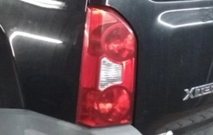 2005-2015 Nissan Xterra Driver LH Quarter Mounted Tail Lamp Light OEM used OEM tail light assembly