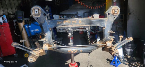 2010 BMW 328i rear suspension crossmember subframe OEM used OEM rear subframe and crossmember