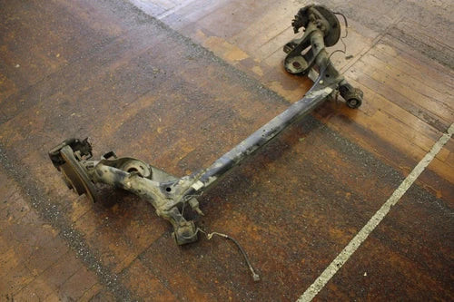 99 VOLKSWAGEN NEW BEETLE 2.0 AUTO REAR AXLE SUBFRAME BRAKE ROTORS ASSEMBLY OEM used OEM rear subframe and crossmember