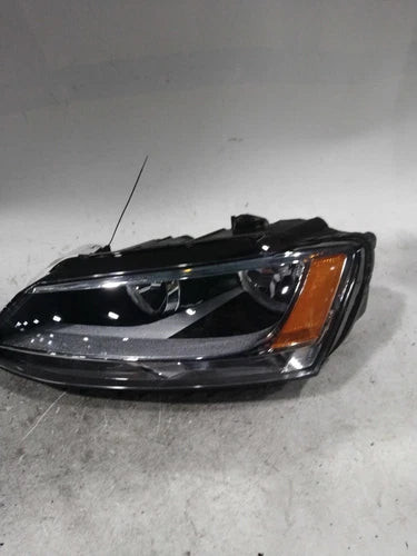 Used OEM Blue Headlight Assembly Left 2014 Volkswagen Jetta 141K Tested used OEM headlight