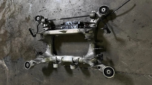 2010-2012 BMW 750i XDRIVE REAR AXLE CARRIER SUBFRAME CROSSMEMBER 6794666 OEM used OEM rear subframe and crossmember