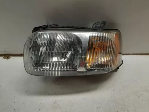 Driver Left Headlight Assembly Fits 2001-2004 FORD ESCAPE used OEM headlight