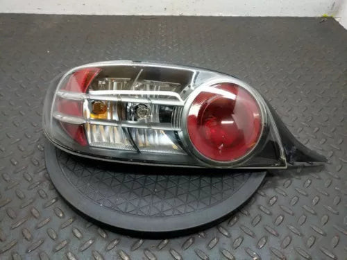 Driver Tail Light Silver With Red Lens Surround Fits 2004-2008 MAZDA RX8 used OEM tail light