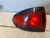 Driver Tail Light 4 Door Quarter Panel Mounted Fits 95-99 Pontiac SUNFIRE used OEM tail light