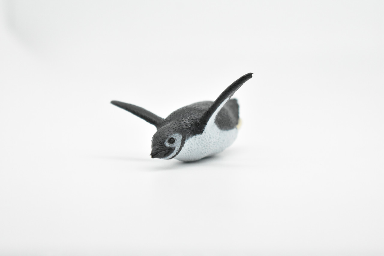 A cute little penguin folded from a washcloth and a small rubber