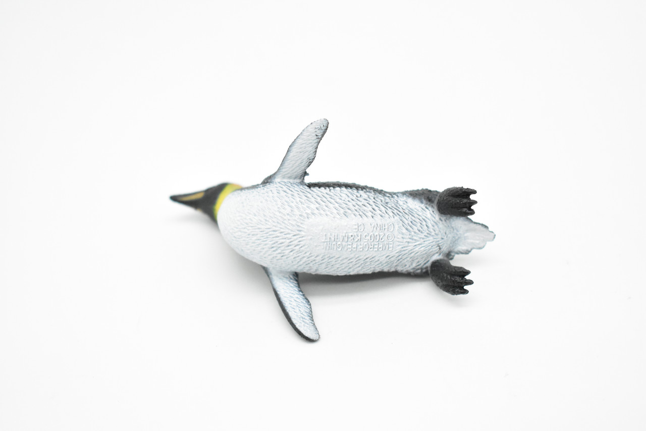 A cute little penguin folded from a washcloth and a small rubber