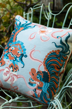 Lion Dance Blue Cushion by Guo Pei cushion insitu