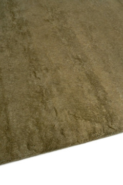 Mohair Shag rug in Olive, angled flatshot showing pile direction