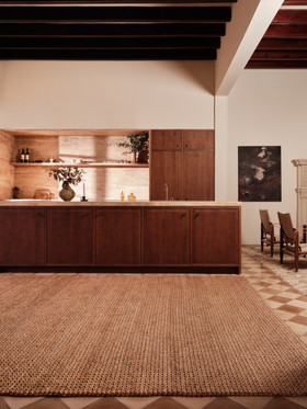 Abaca Herringbone Camel by The Rug Company - roomset image