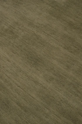 Close-up of Caliche Silk rug in Olive, showing lustrous silk sheen