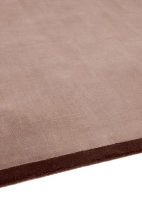 Margo rug in Peony, studio detail shot showing the graphic contrast border edge