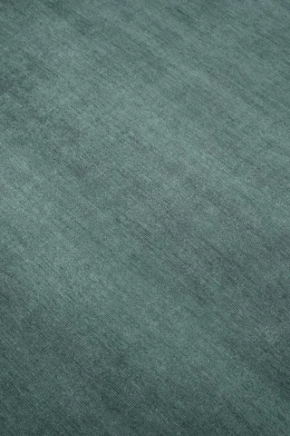 Close-up of Caliche Silk rug in Aegean, showing lustrous silk sheen