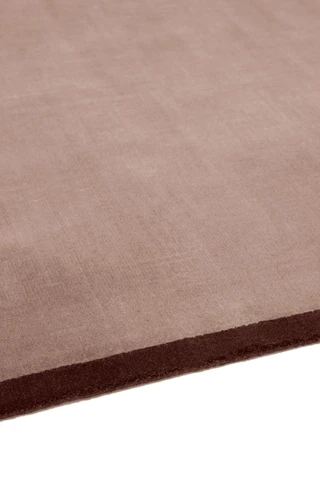 Margo rug in Peony, studio detail shot showing the graphic contrast border edge