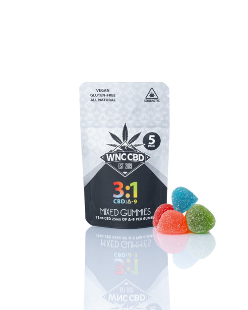 3:1 Mixed EXTRA STRENGTH Δ9 Gummies, colorful chewy gummies beside WNC CBD packaging, vegan label.