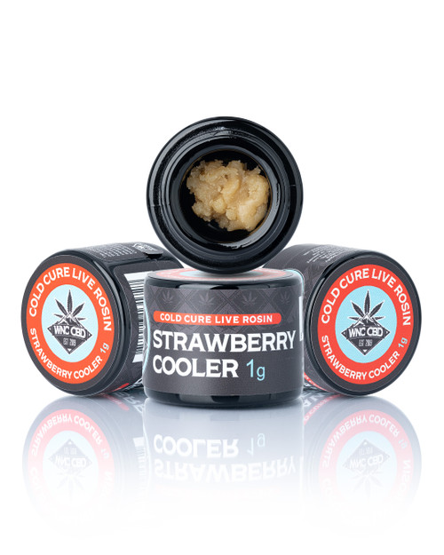 Strawberry Cooler Cold Cure Live Rosin 1g in black jars, soft beige concentrate, WNC CBD logo.
