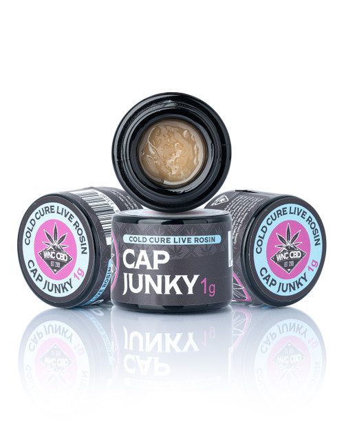 Cap Junky Cold Cure Live Rosin in black jar, creamy texture, pink/blue branding, 1g label.