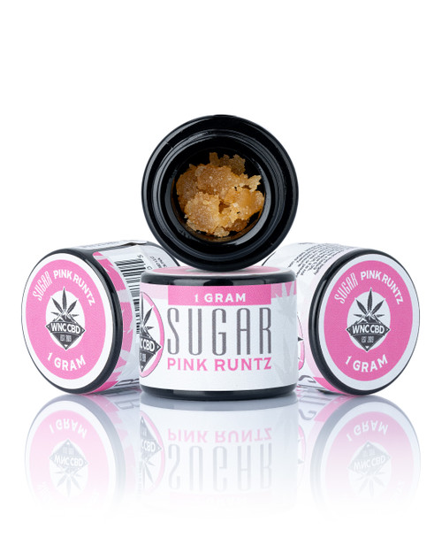 Pink Runtz Sugar (84.100% THCa) in black jars with crumbly orange extract, labeled with pink accents.
