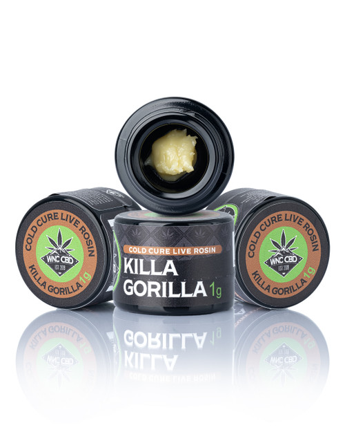 Killa Gorilla Cold Cure Live Rosin in black containers, creamy texture visible inside jar.