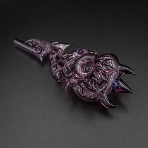 JDZ Folium Viride glass pipe in purple with intricate design and swirling spikes, from WNC CBD Glass Accessories.