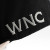 Close up of the grey embroidered WNC letters on the side of a black WNC World Needs Cannabis snapback hat 