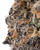 Close up of a dense Super Boof cannabis bud showing deep green and dark purple leaves, burnt orange pistils, and a frosty, crystalline layer of trichomes