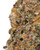 Close up of a dense Sour Apple cannabis bud, displaying olive green and dark purple foliage intertwined with burnt orange pistils and heavily coated in sparkling white crystal trichomes 