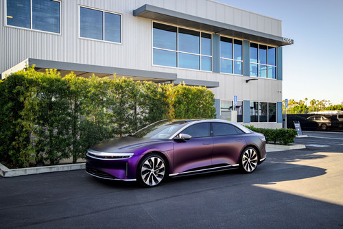 This stunning Lucid EV showcases the futuristic KPMF K75565 Matte Purple Black Iridescent Vinyl wrap, turning heads with its sleek, otherworldly finish. The wrap’s subtle shift from deep purple to black highlights the car's smooth, aerodynamic design, offering a striking contrast that enhances its modern aesthetic. The matte texture complements the electric vehicle's clean lines, providing a bold yet refined look that stands out on the road.