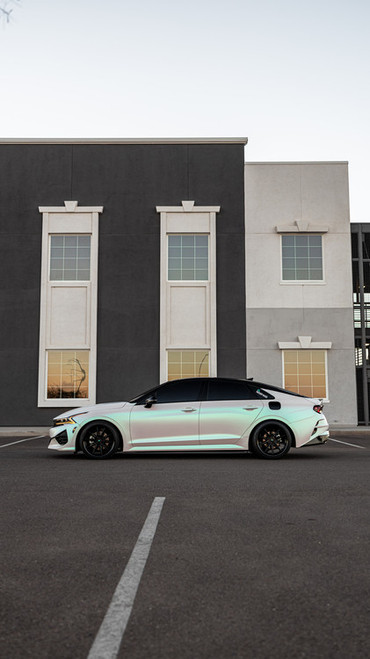 A Lexus sedan wrapped in KPMF Matte Aurora Pearl vinyl, showcasing a soft satin matte surface with iridescent pearl undertones that subtly shift under natural light, delivering a high-end, elegant finish.