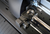 Graphtec CE8000 Blade Holder: A detailed view of the upgraded blade holder on the Graphtec CE8000 Series. This image captures the precision tool holder design, highlighting the smooth sliding mechanism that simplifies changing tools and adjusting blade positions.