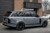 A sporty Land Rover wrapped in KPMF K75400 Gloss Ominous Gray, showcasing the vinyl's smooth, high-gloss texture. The sleek gray tone adds a bold, stealthy style perfect for performance vehicles.
