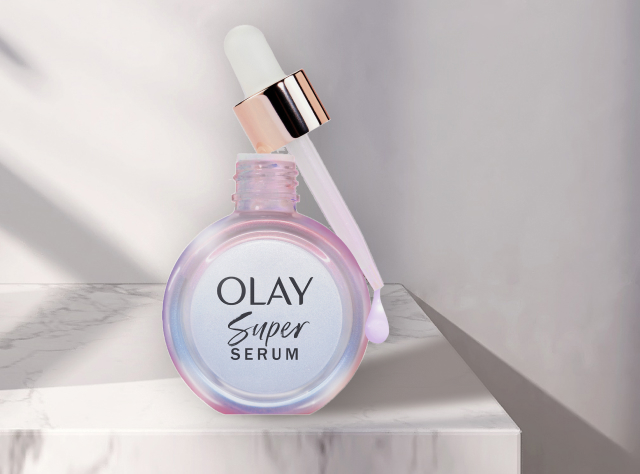 Olay Super Serum on a white marble countertop and discount code SUPER