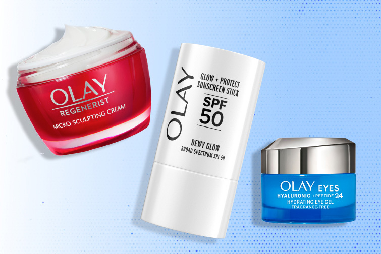 Group of Olay moisturizers and sunscreen products in front of a blue background