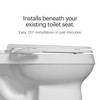 Side view of the PureSpa bidet attachment beneath an existing toilet seat, with easy DIY installation in minutes.