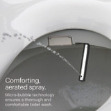 Swash 1000 bidet spraying water from its nozzle. Text highlights comforting, aerated spray with micro-bubble technology for a thorough and gentle wash.