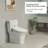 Swash 1400 bidet toilet seat installed in a modern bathroom, engineered for North American toilets with a secure fit and no seat gap; remote control mounted nearby for easy access.