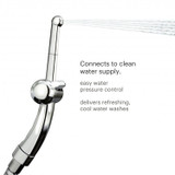 Brondell CleanSpa advanced hand-held bidet sprayer spraying water. Copy:  Connects to clean water supply.  Easy water pressure control.  Delivers refreshing cool water washes.