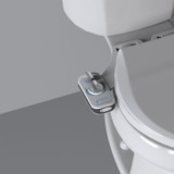 Brondell PureSpa advanced warm water bidet attachment with single nozzle installed in front of a grey background