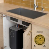 Brondell Circle RC100 installed beneath a kitchen sink beside a WQA certification seal, highlighting its tested and certified filtration system.