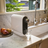 Cypress Countertop Water Filtration System holds a small footprint on a modern marble countertop.