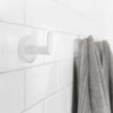 Nebia Hook Set Glossy White on a white wall with a gray towel hanging