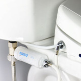 Omigo In-Line Bidet Filter installed in standard toilet to protect bidet seat from hard water and filter unwanted chlorine, sediments, minerals and more from your wash.