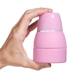 Omigo Collapsible Travel Bidet blush, fully collapsed in human hand