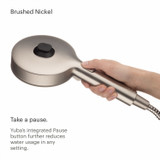 Brondell Nebia Yuba 5-Setting Handshower with hand holding the brushed nickel HaloNetic Double Docking System displaying rear of showerhead with pause mode button.