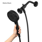 Nebia Merritt 5-Setting Handshower with HaloNetic Double Docking System in matte black, hand holding handshower.