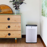Aurabeat air purifier placed in the corner of a room