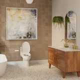 Brondell Swash CL2800 Luxury Bidet Toilet Seat with Remote Control installed in a clean bathroom with large framed art, arched accent mirror and wooden vanity.