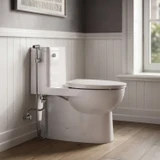 Brondell PureSpa Luxury Hand-held Bidet Sprayer PS-80 installed beside a toilet with stainless steel hose and convenient tank-mounted holster.