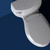 Brondell Lumawarm toilet seat installed in standard toilet with navy background